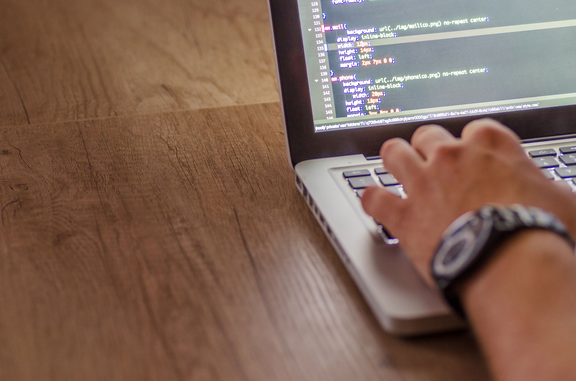 Developer adding a website feedback button with a laptop and timer nearby