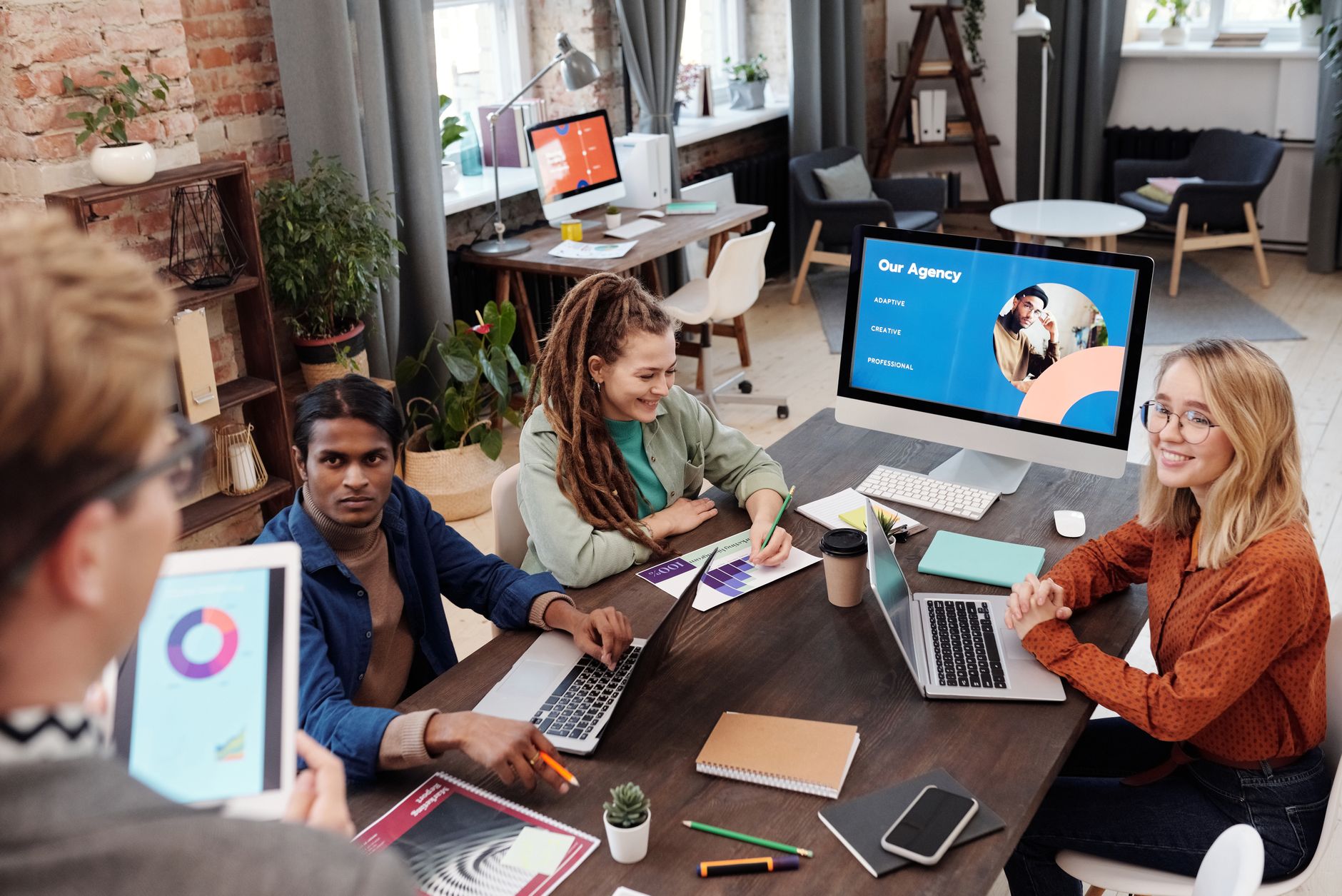 Creative agency team managing multiple client Webflow sites