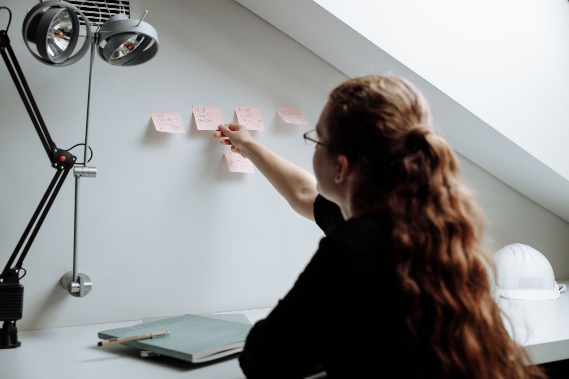 Product manager organizing feedback on a wall without a public roadmap